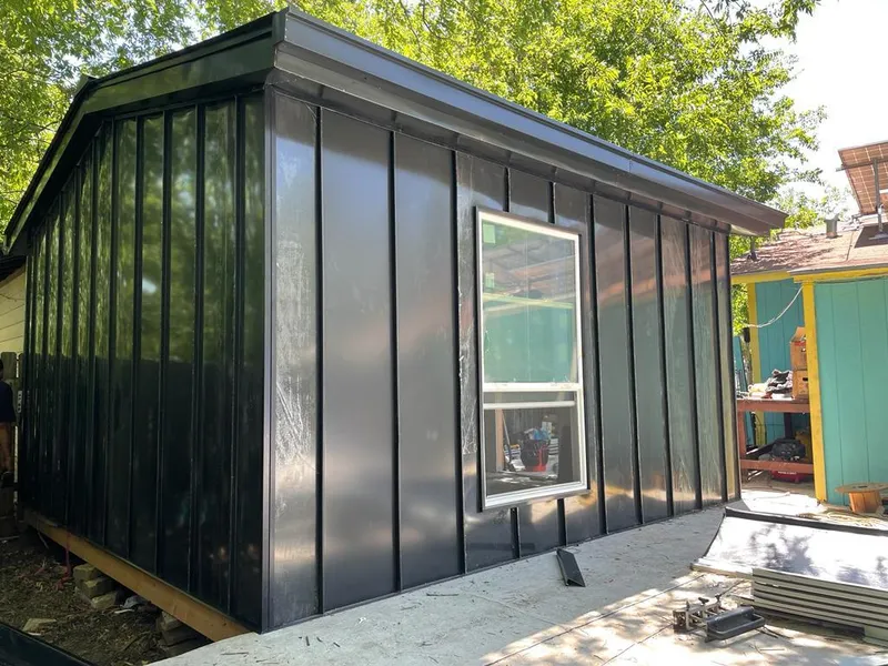 Black standing seam metal wall panels for Roof Inspection in Essex